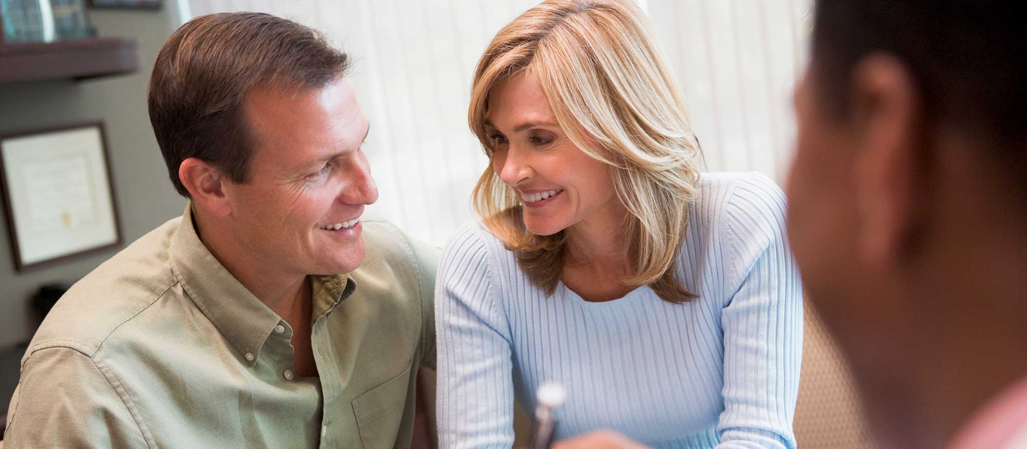 A couple that is happy with the conversation they've had with their naturopathic doctor about their options to enhance their fertility with naturopathic medicine